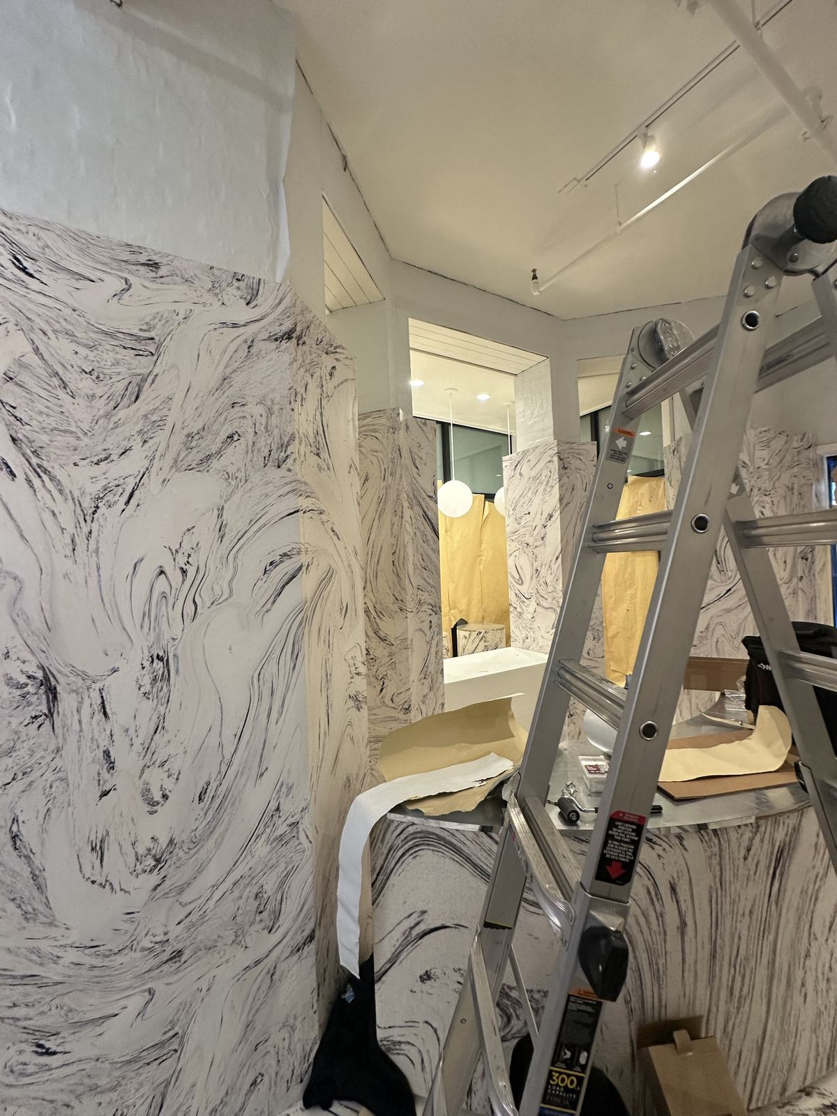 Marble-print wall wraps in a retail interior