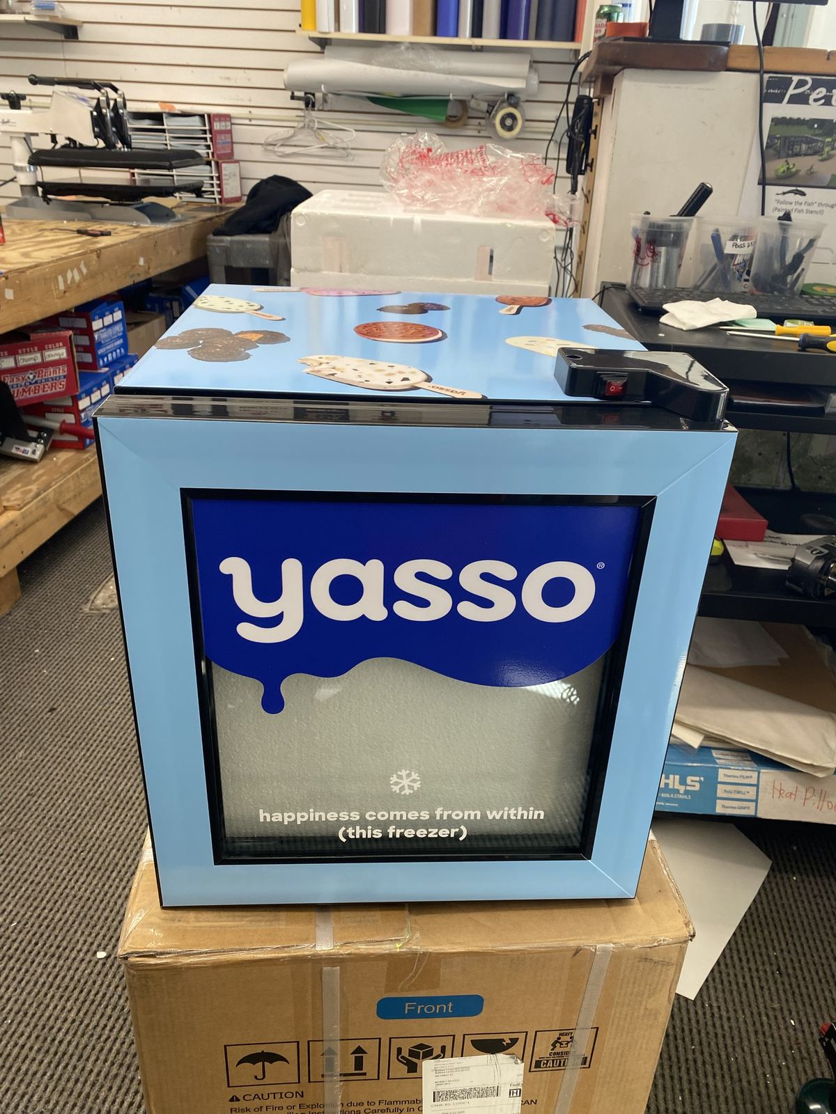Display freezer wrap with door graphic