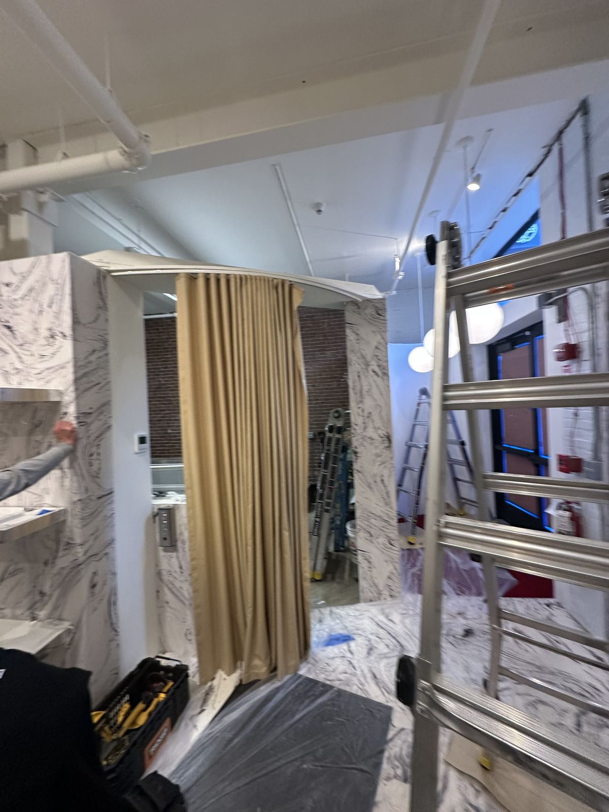 Wrapped fitting room and interior walls