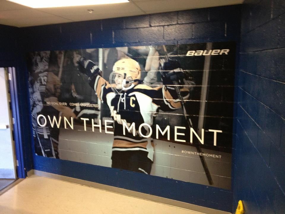 Wall wrap installed on a painted concrete block wall