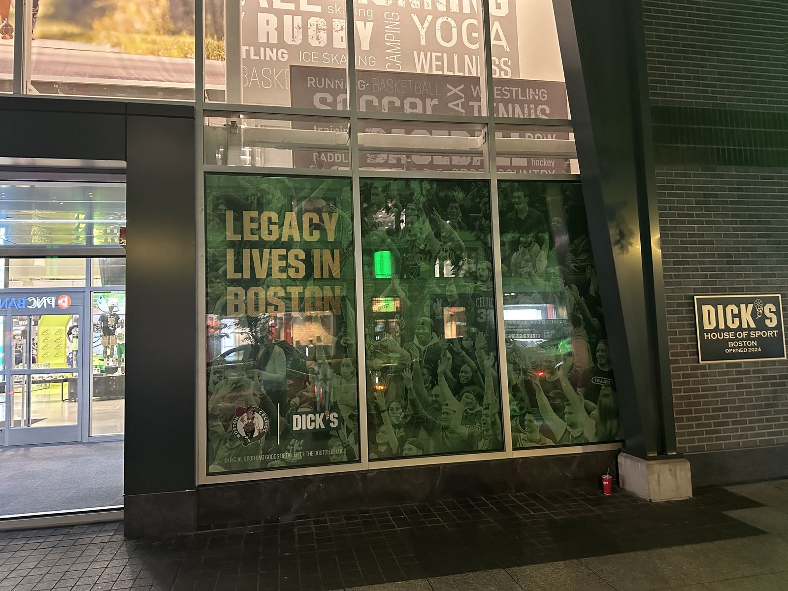 Retail window graphics installed on storefront glass